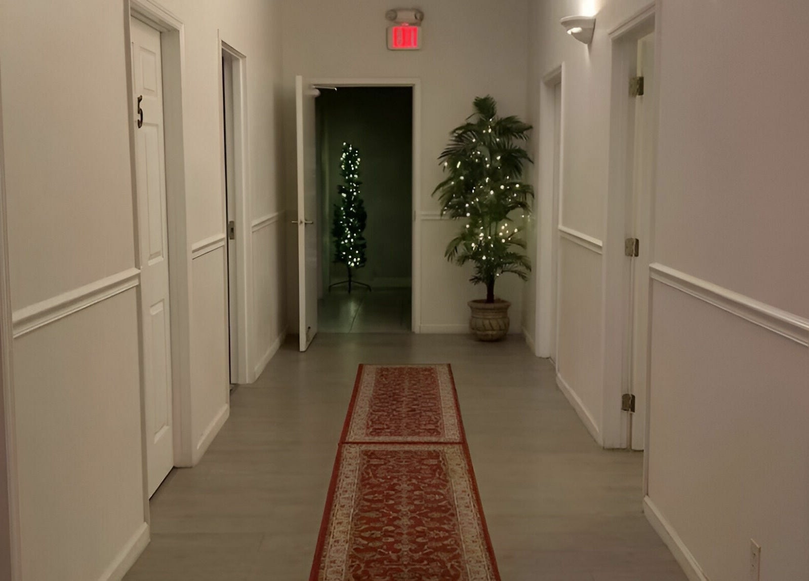 Tranquil hallway at Healing Spa & Massage in West Palm Beach, Florida, US, lined with softly lit plants.