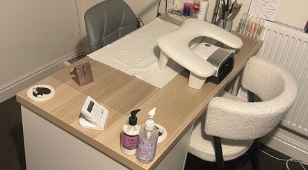 Nail treatment desk at KeeKeesBeauty in Swindon, England, GB, equipped with manicure tools and comfortable seating.