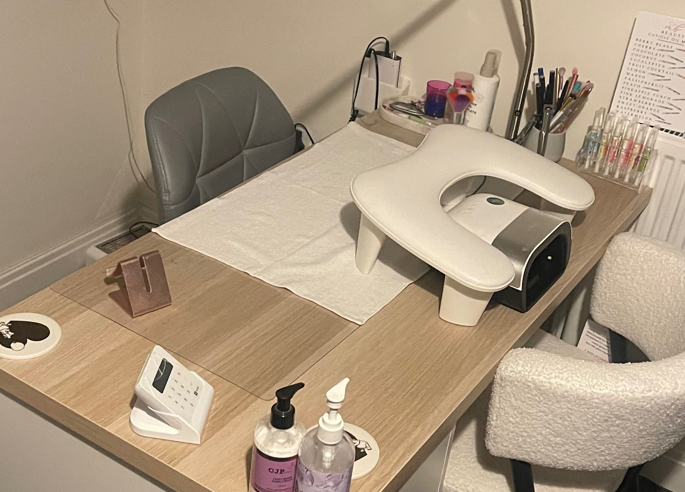 Manicure station at Keekeesbeauty in Swindon, England, GB, featuring tools and accessories for nail care.