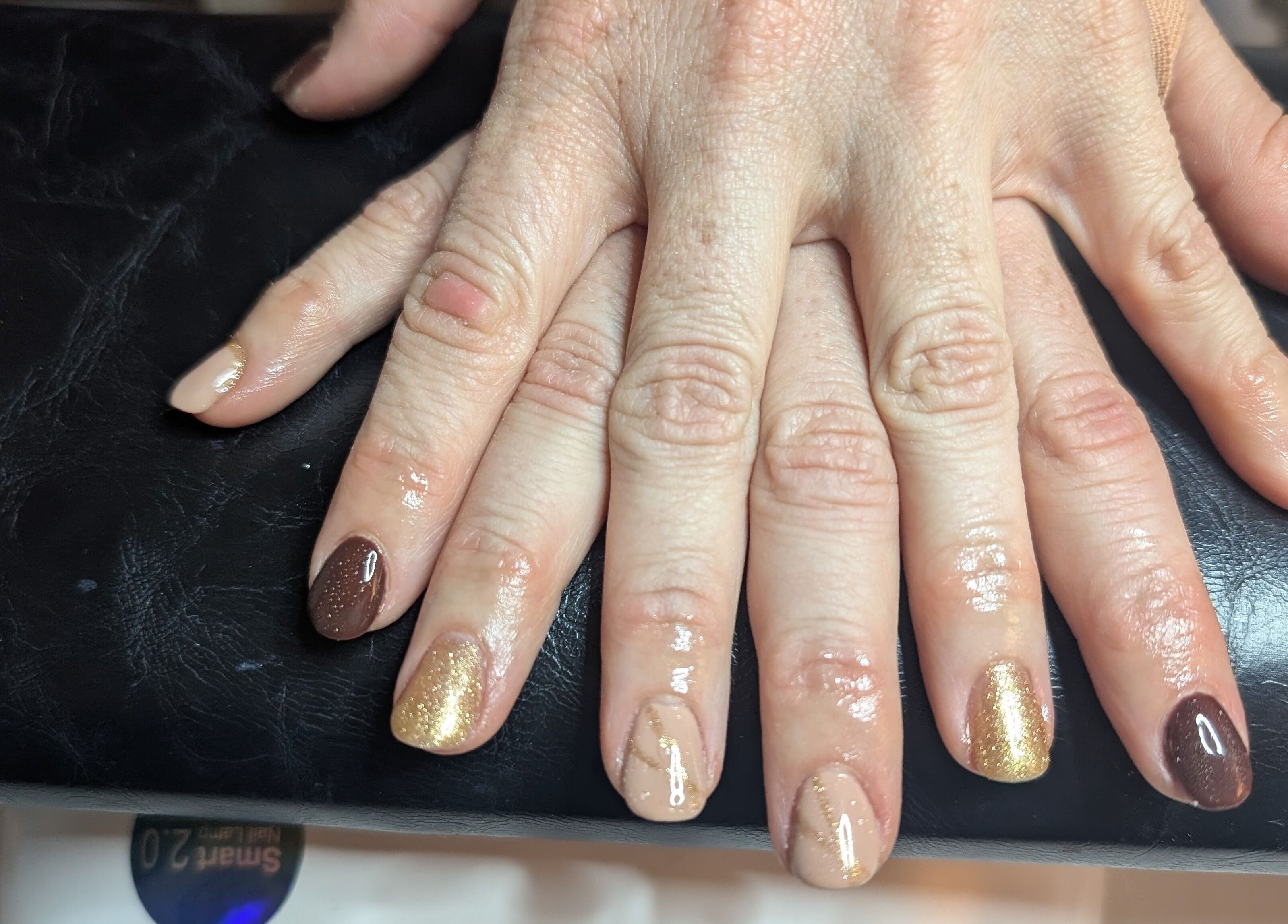 Elegant nail art in brown and gold hues at Lashes by Dee, Weymouth, England, GB.