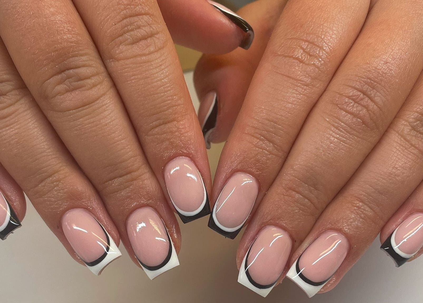 Elegant French manicure with black tips at By Emer in carlow, carlow, IE.