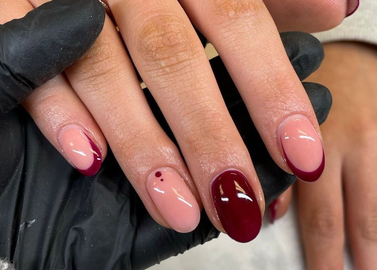 Chic burgundy nail design by By Emer, Carlow, Carlow, IE, showcasing intricate nail art on manicured hands.