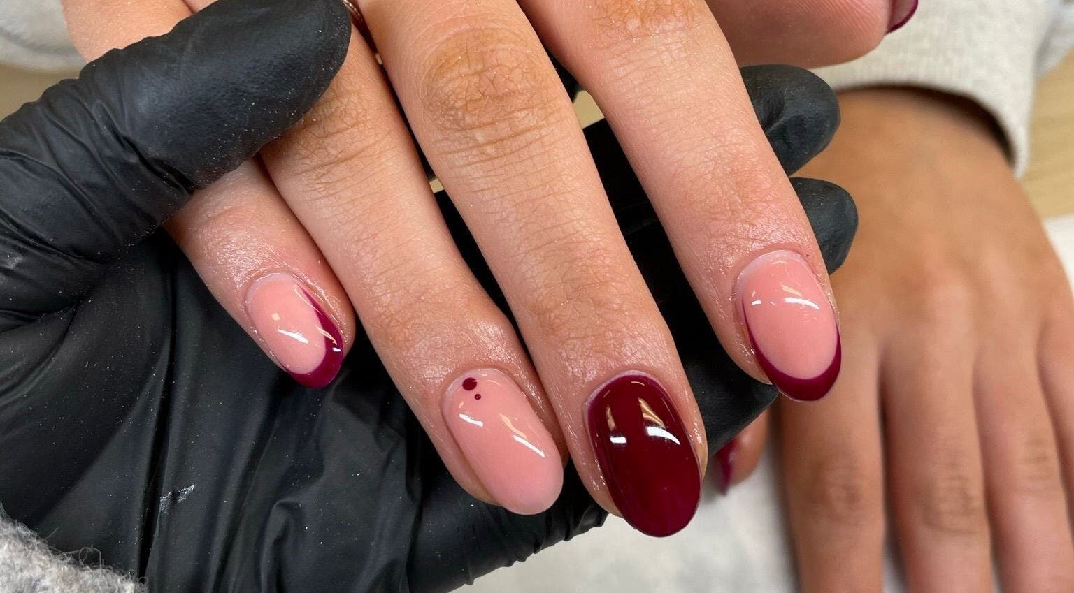 Chic burgundy nail design by By Emer, Carlow, Carlow, IE, showcasing intricate nail art on manicured hands.