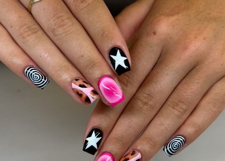 Creative nail art with stars and spirals by By Emer, Carlow, Carlow, IE. Vibrant, unique designs.