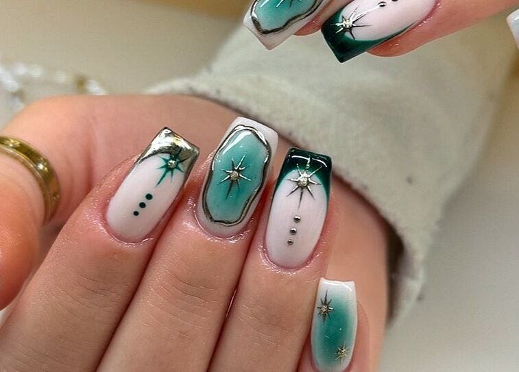 Intricate emerald nail art design at By Emer, Carlow, Carlow, IE. Elegantly crafted with star accents.