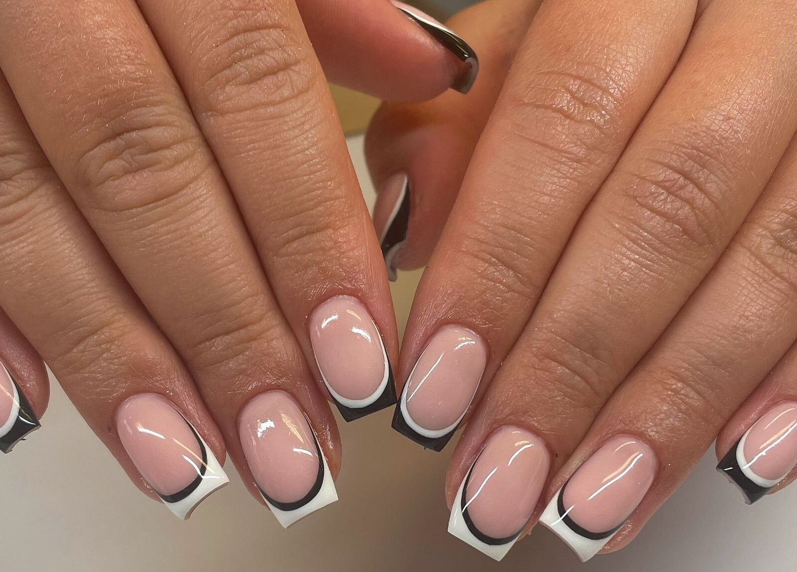 Elegant black and white French manicure by By Emer in carlow, carlow, IE.