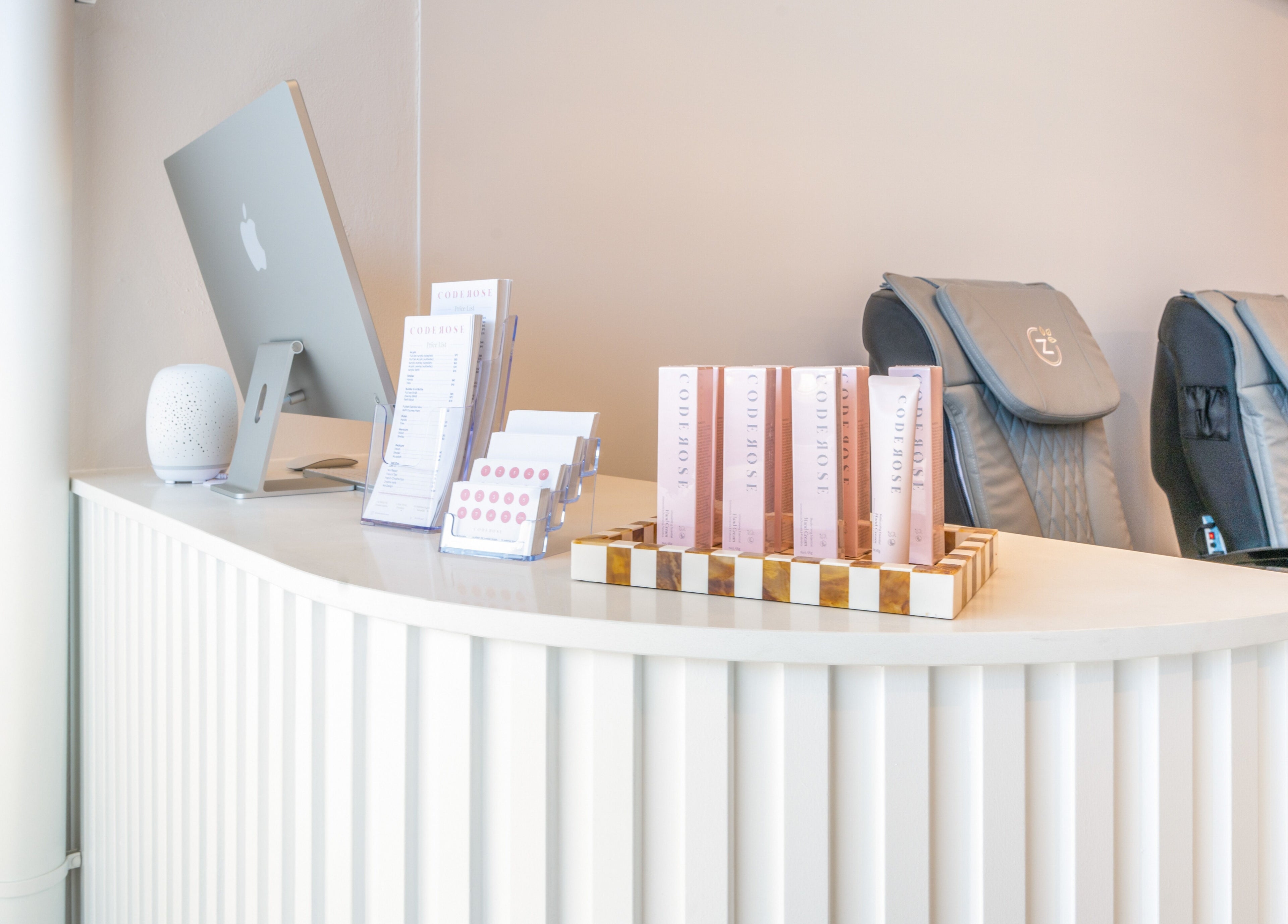 Reception area at Code Rose - Yarraville, featuring elegant decor and product displays, Melbourne, Victoria, AU.