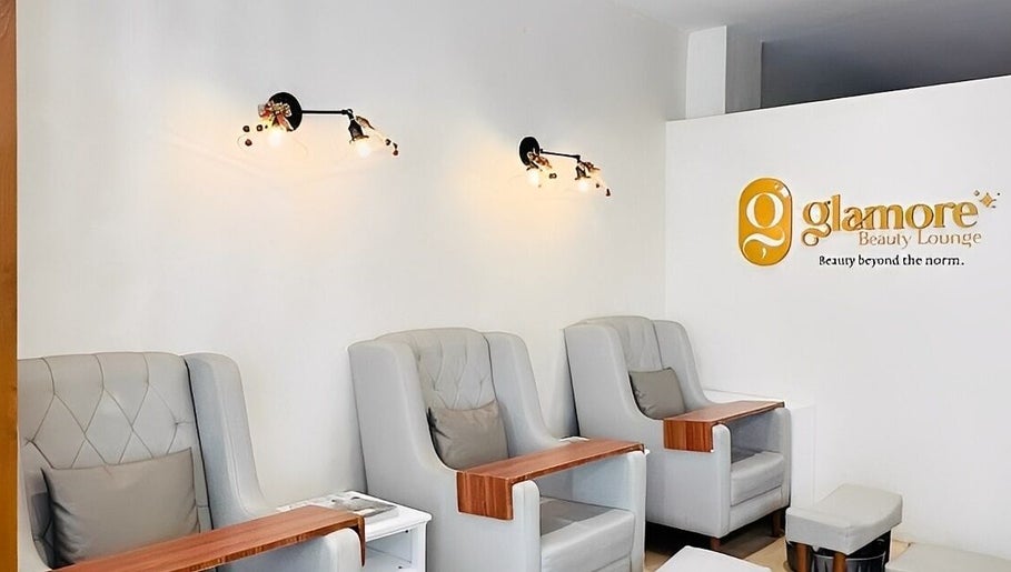 Stylish chairs at Glamore Beauty Lounge Jaro Branch, Iloilo City, Western Visayas, PH with elegant lighting.