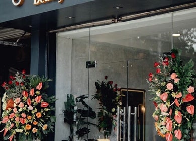 Elegant entrance of Glamore Beauty Lounge Jaro Branch, Iloilo City, Western Visayas, PH with floral decor.