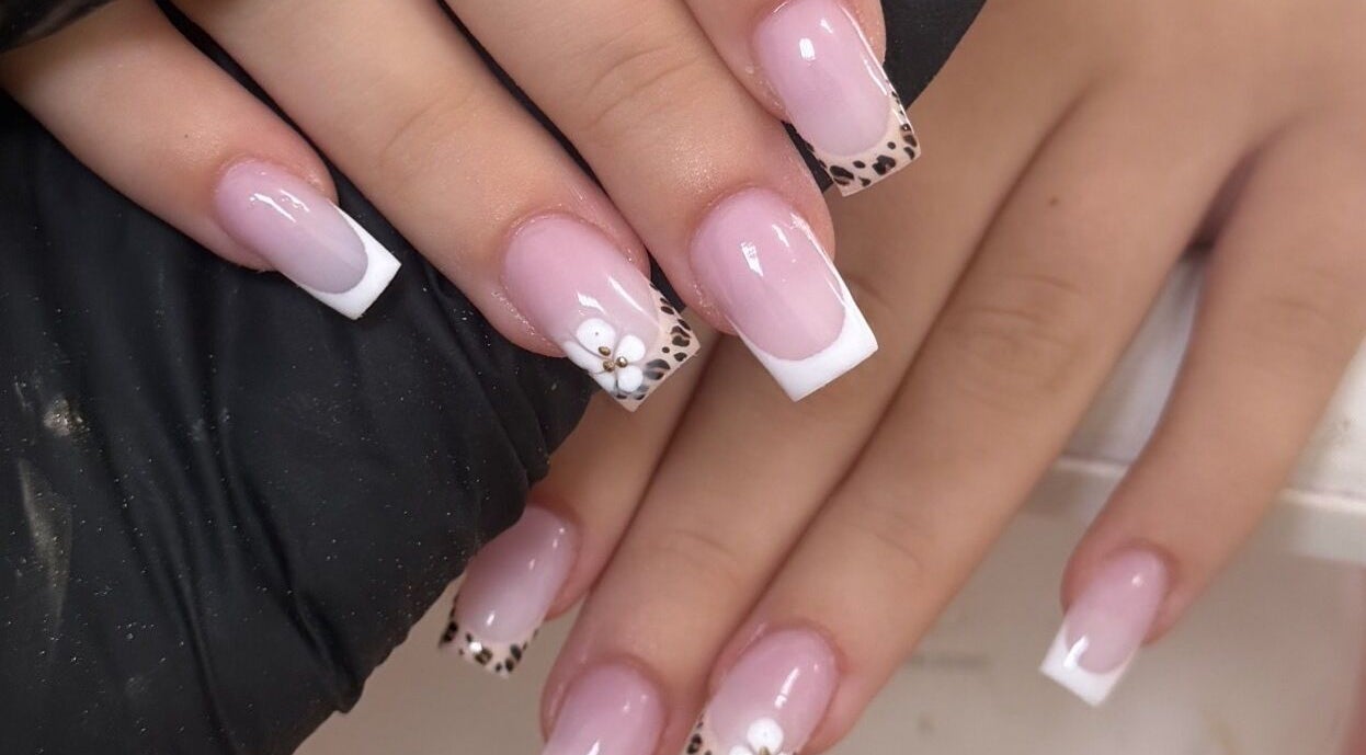 Elegant nail art at Bella nails and beauty xx in Halstead, England, GB, featuring leopard print and floral designs.