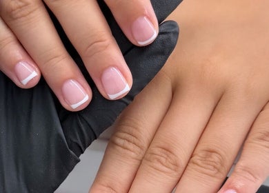 Elegant French manicure at Bella nails and beauty xx in Halstead, England, GB. Perfectly styled nails.