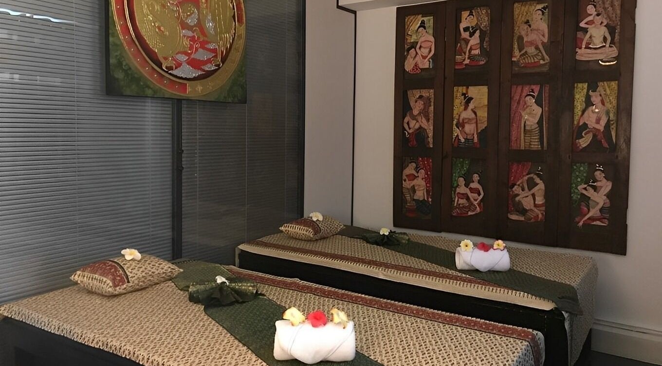 Serene Thai massage room at Ruen Thai Spa, Milton Keynes, England, GB, featuring traditional decor and relaxing beds.