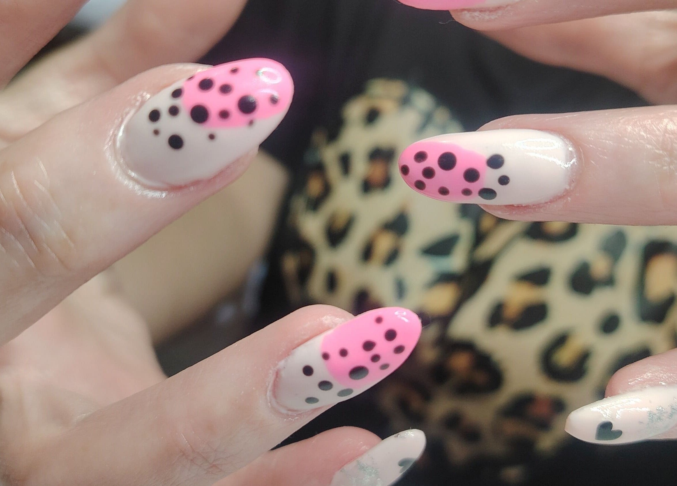 Stylish polka dot nail art at Funky Nails, Alberton, Gauteng, ZA. Featuring pink and black designs.