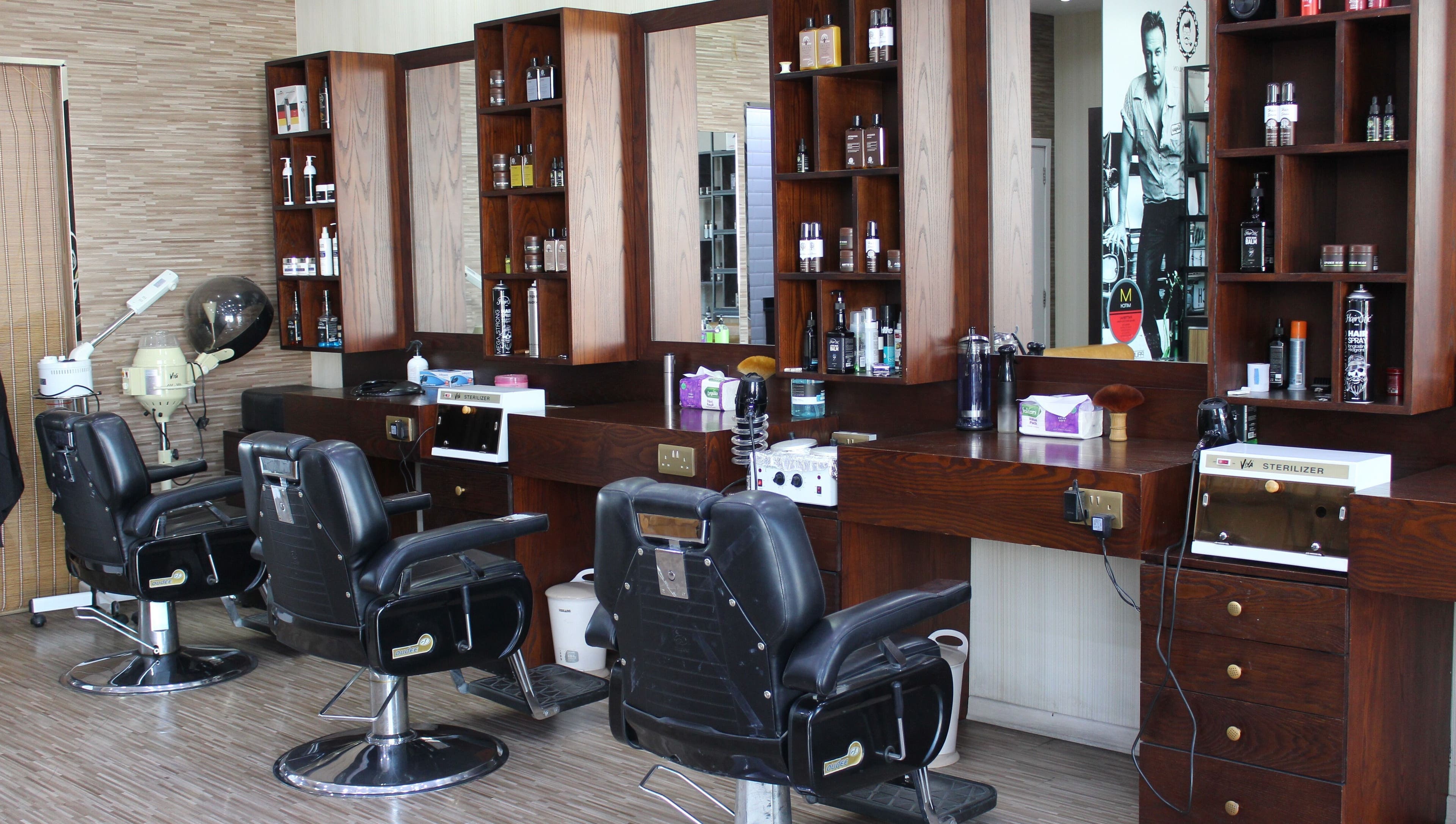 Sleek styling chairs at The One Gents Salon (Impz Branch), Dubai, Dubai, AE offer a luxurious grooming experience.