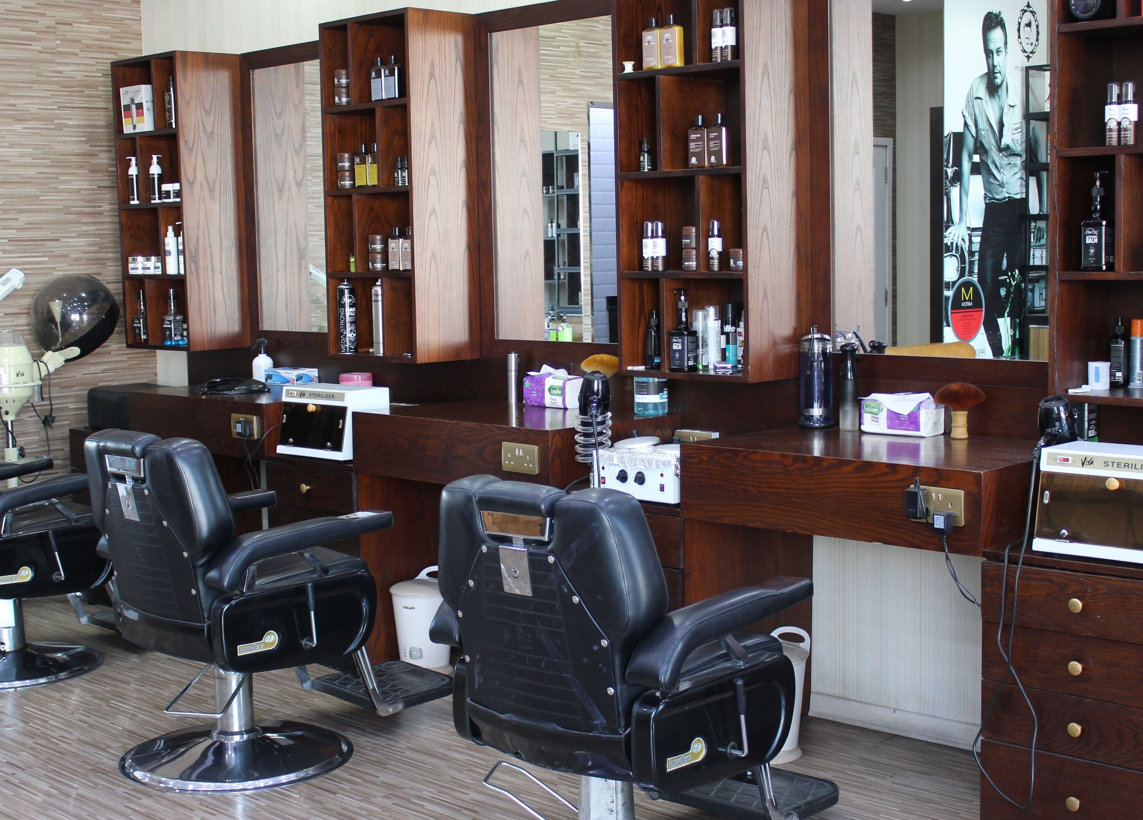 Sleek styling chairs at The One Gents Salon (Impz Branch), Dubai, Dubai, AE offer a luxurious grooming experience.