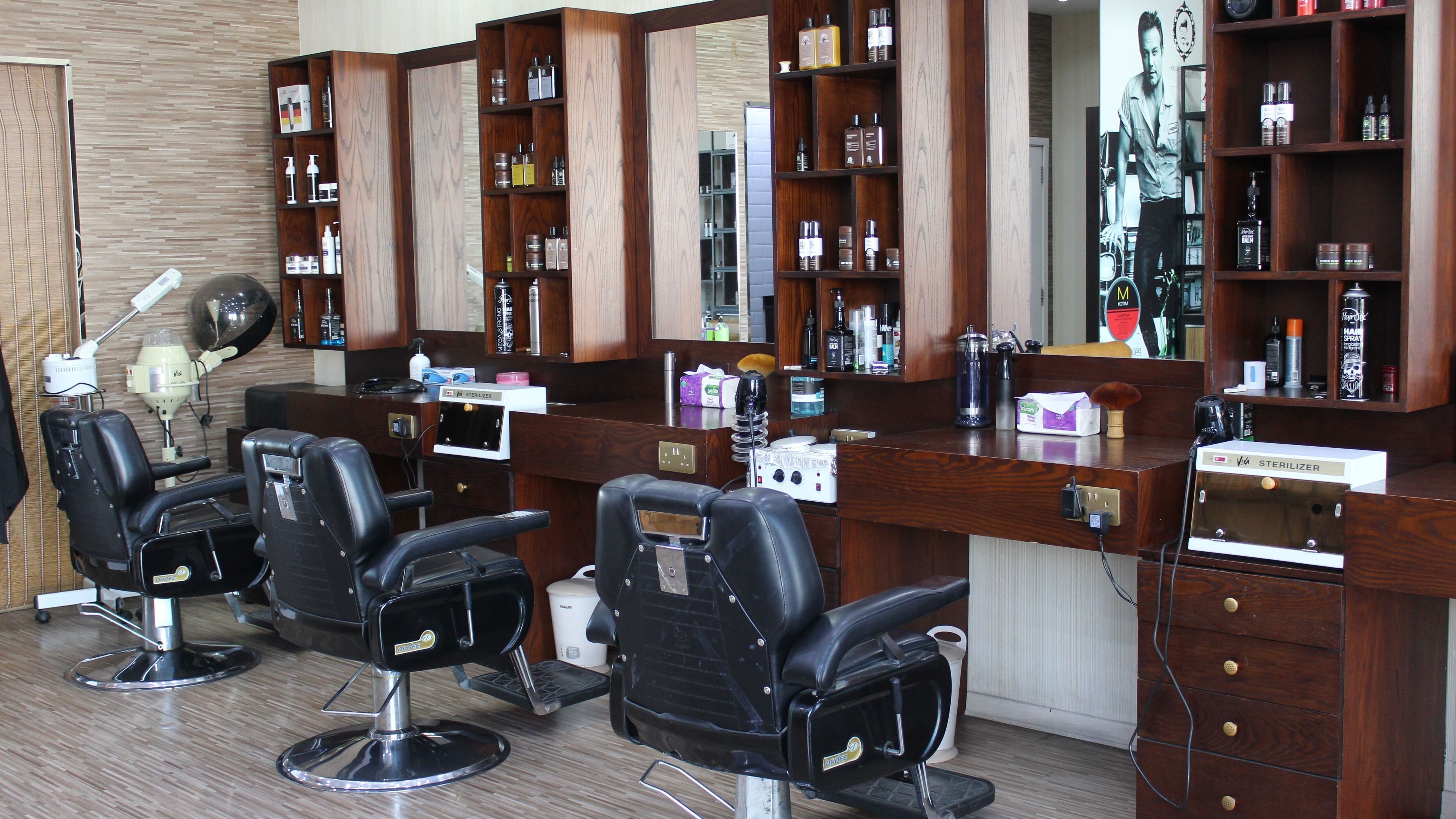 Sleek styling chairs at The One Gents Salon (Impz Branch), Dubai, Dubai, AE offer a luxurious grooming experience.