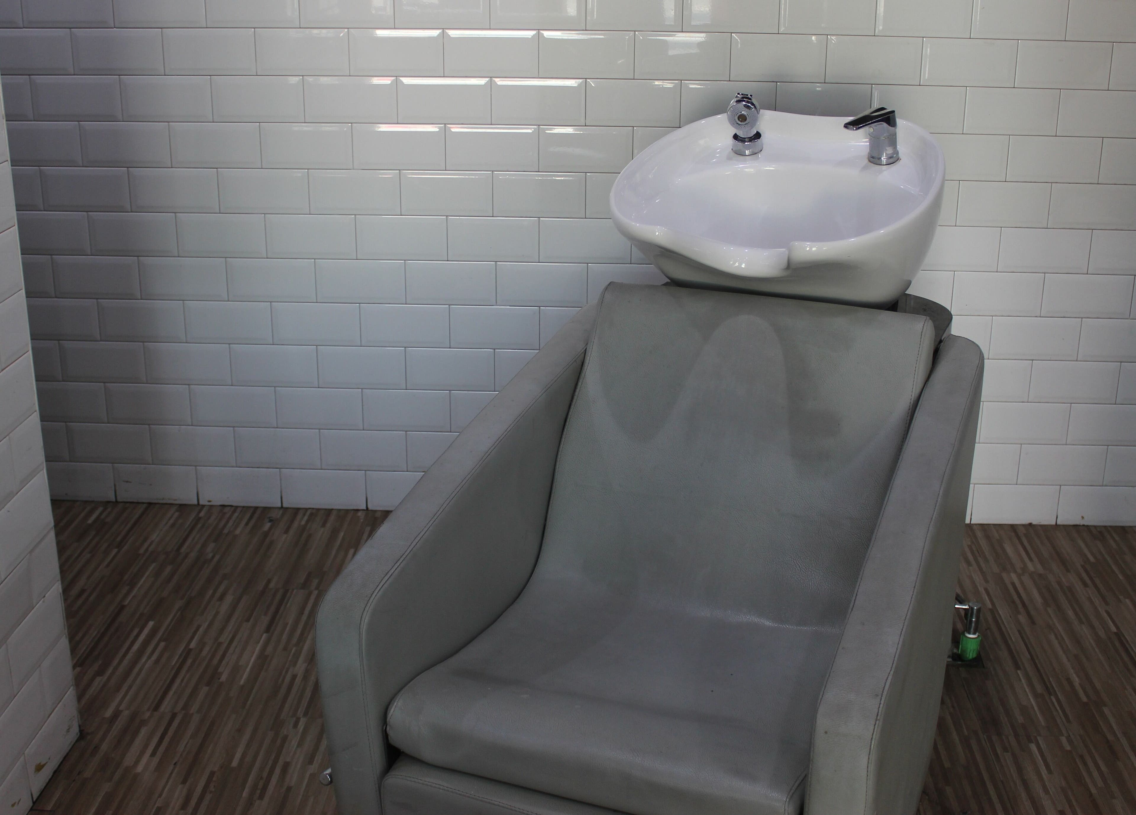 Modern wash station at The One Gents Salon (Impz Branch), Dubai, Dubai, AE offers comfort and style.