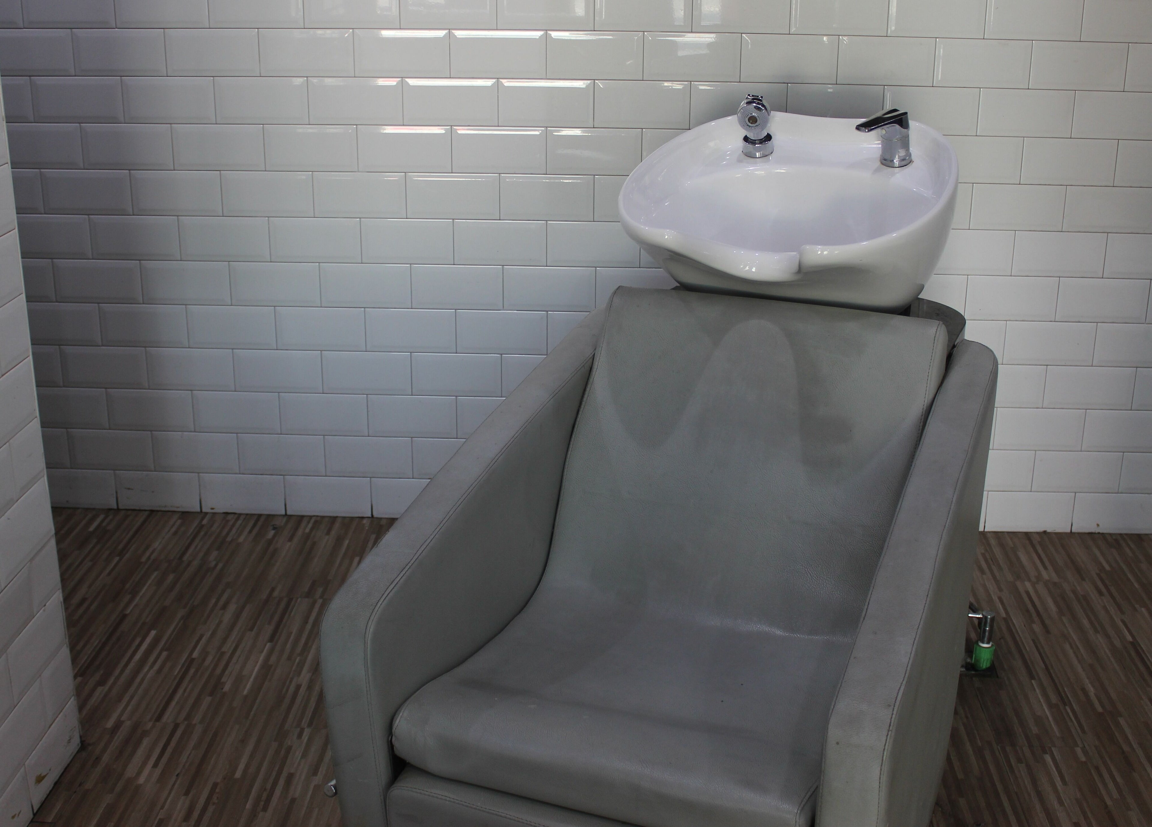 Modern wash station at The One Gents Salon (Impz Branch), Dubai, Dubai, AE offers comfort and style.