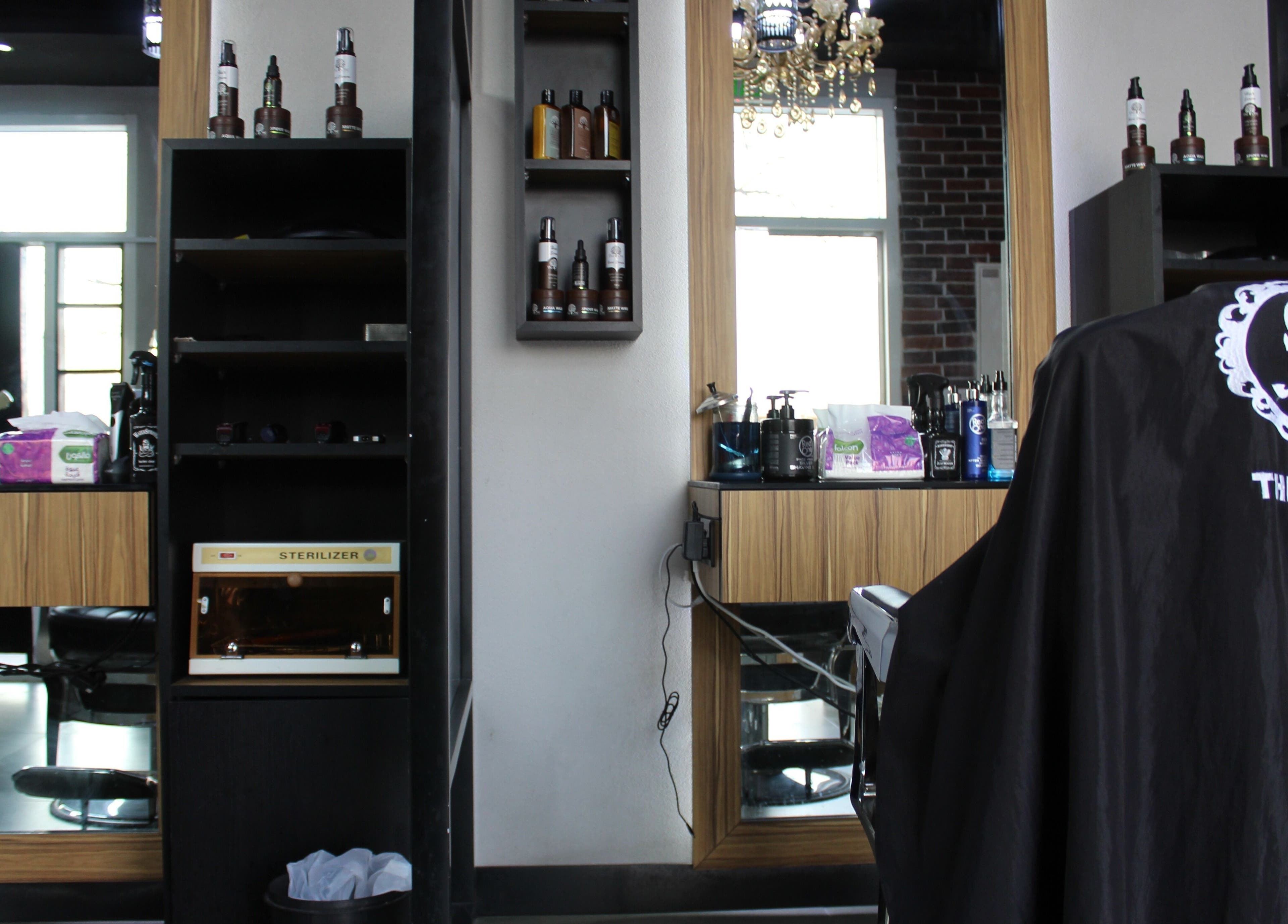 Modern setup at The One Gents Salon (JVT Branch) in Dubai, Dubai, AE with stylish decor and grooming products.