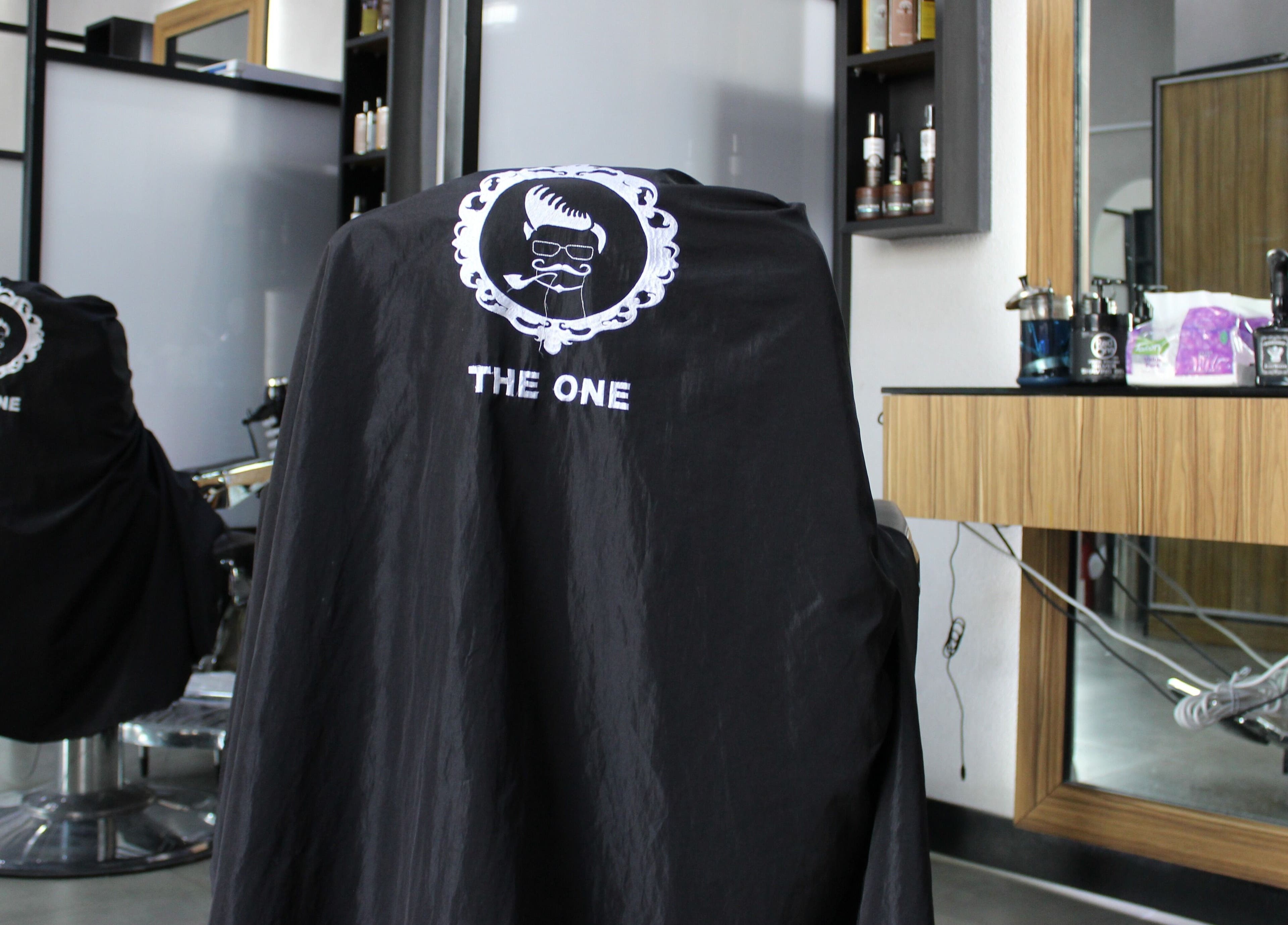 Interior of The One Gents Salon (JVT Branch), Dubai, Dubai, AE, featuring a stylish barber chair.