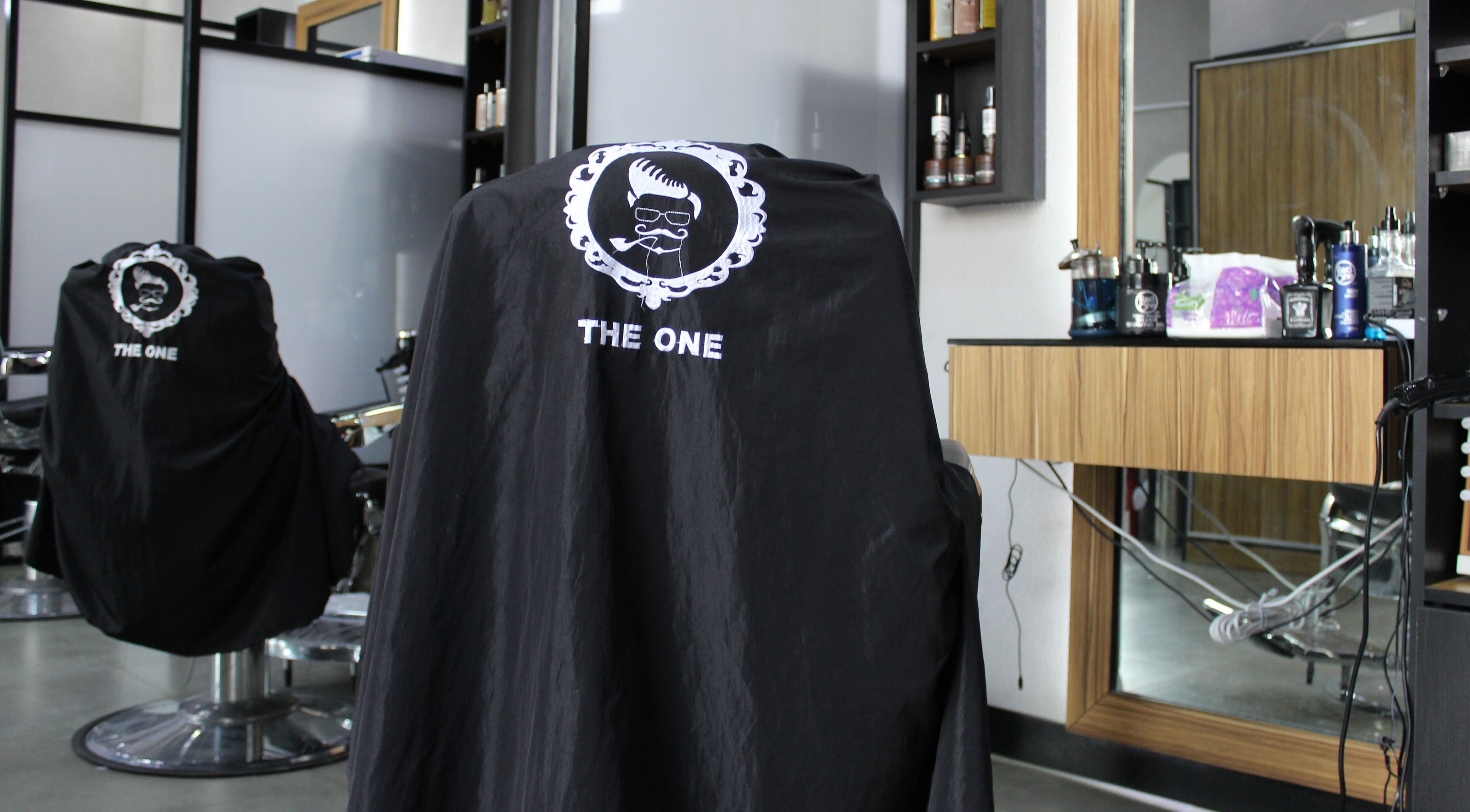 Interior of The One Gents Salon (JVT Branch), Dubai, Dubai, AE, featuring a stylish barber chair.