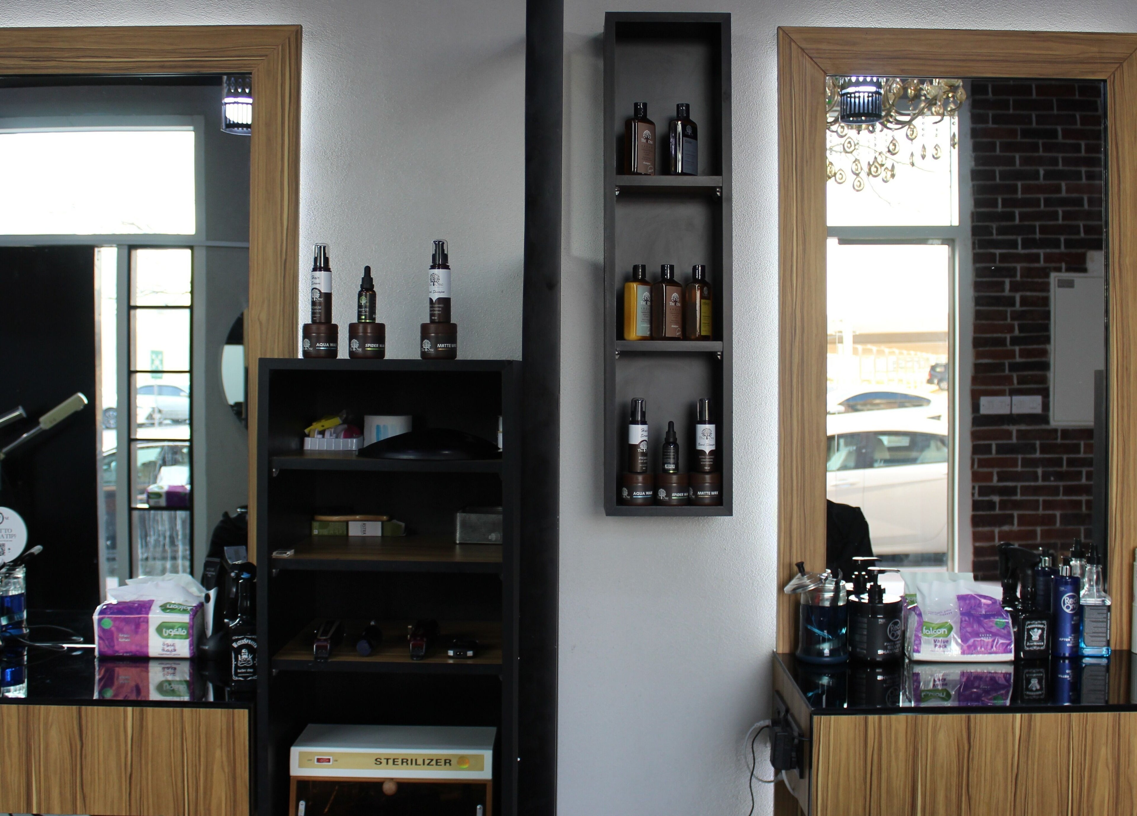 Chic interior of The One Gents Salon (JVT Branch), Dubai, Dubai, AE showcasing grooming products.