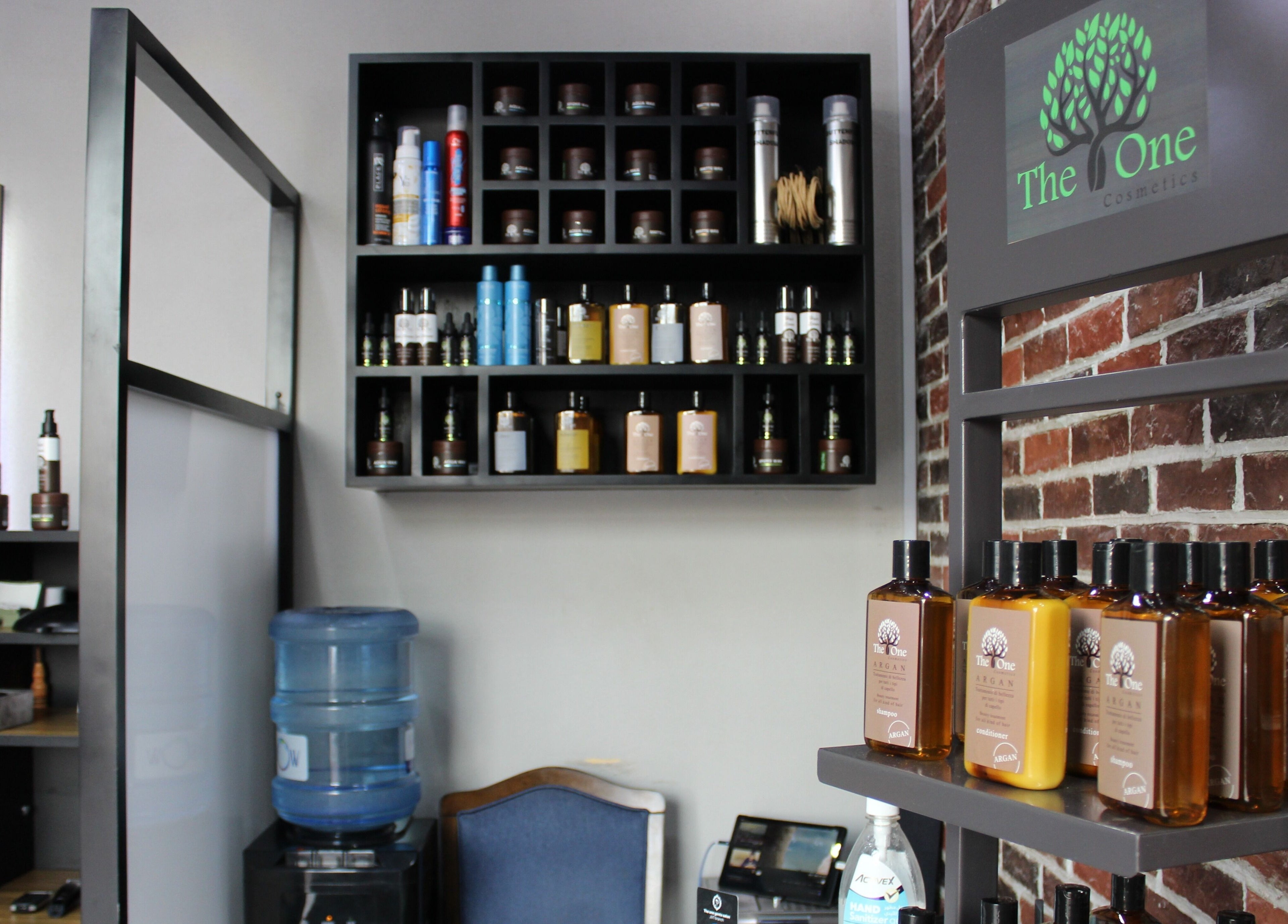 Product shelves in The One Gents Salon (JVT Branch), Dubai, Dubai, AE showcasing premium beauty products.