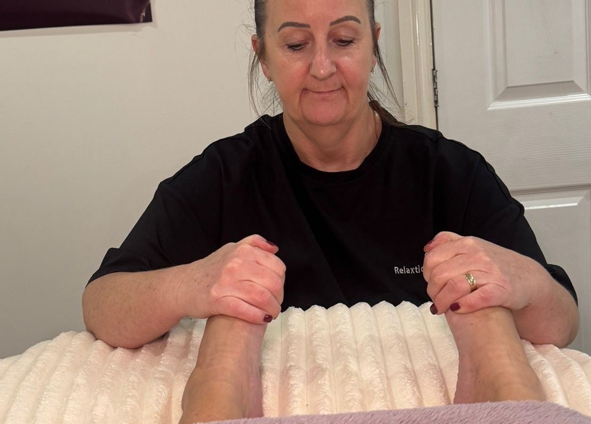 Therapist performing a relaxing foot massage at Catherine Rebalance Therapies, Sheffield, England, GB.