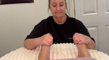 Therapist performing a relaxing foot massage at Catherine Rebalance Therapies, Sheffield, England, GB.