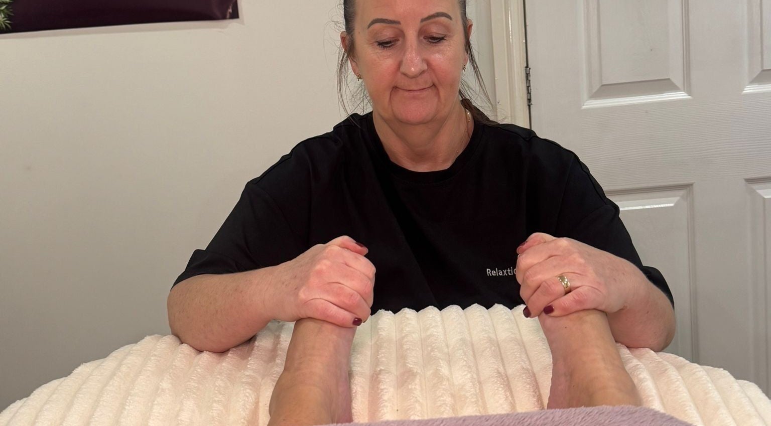 Therapist performing a relaxing foot massage at Catherine Rebalance Therapies, Sheffield, England, GB.