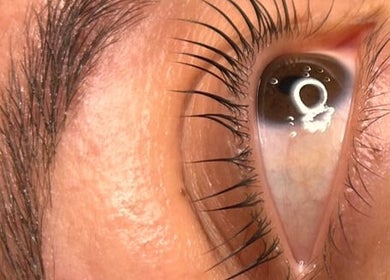 Close-up of a well-groomed eye, highlighting lash treatment at Her.Byron Bay in Suffolk Park, New South Wales, AU.
