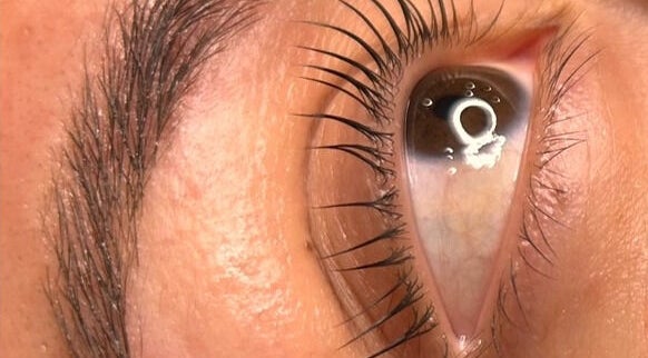 Close-up of a well-groomed eye, highlighting lash treatment at Her.Byron Bay in Suffolk Park, New South Wales, AU.