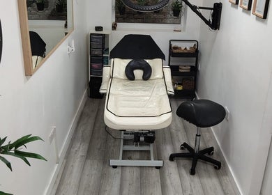 Chic treatment room at Wake Up With Brows UK, London, GB, featuring a comfortable chair and stylish decor.