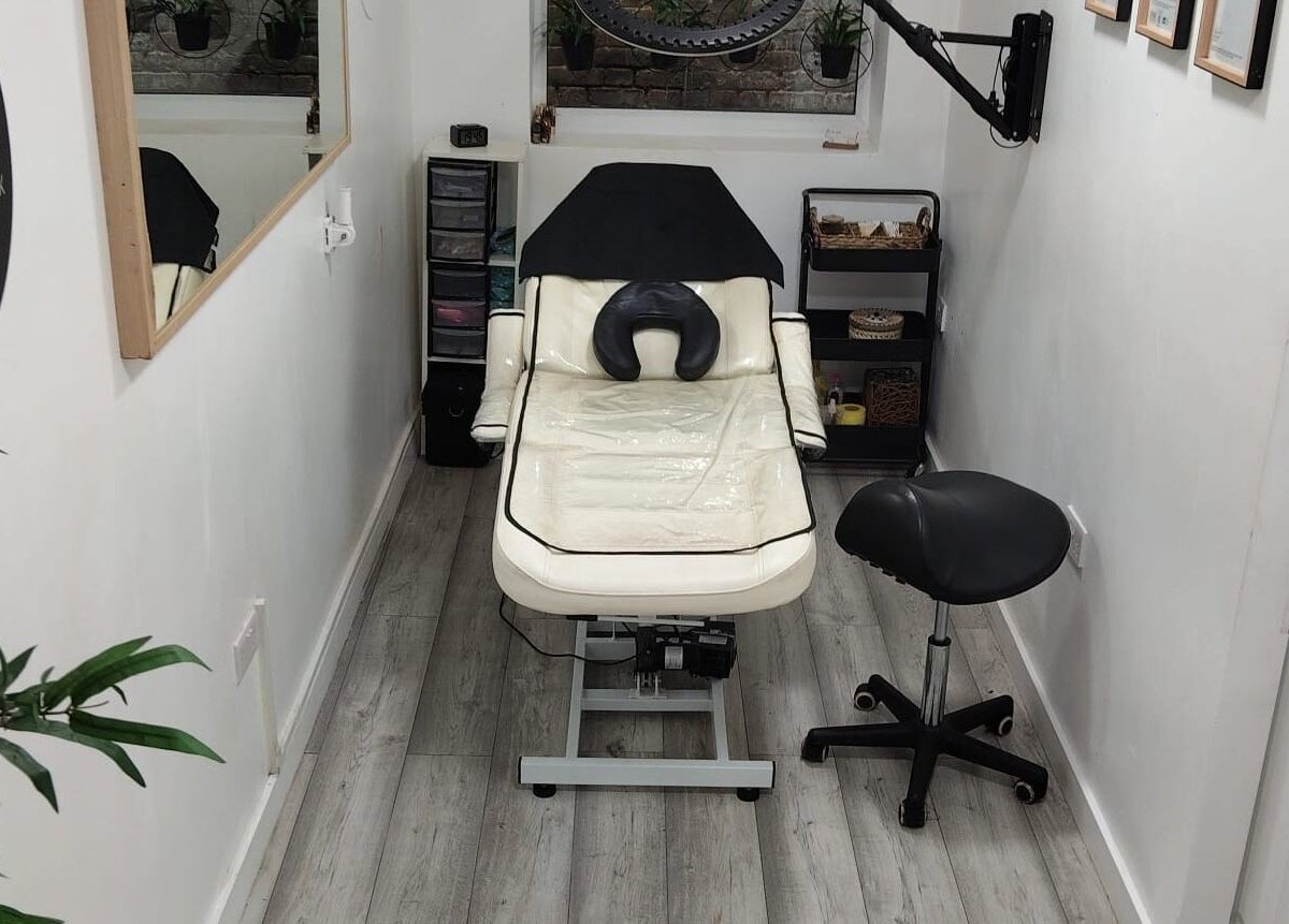 Chic treatment room at Wake Up With Brows UK, London, GB, featuring a comfortable chair and stylish decor.
