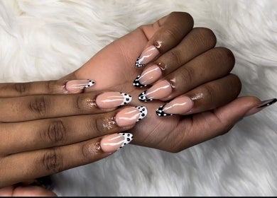 Artistic nail design by MakeupbyLGA in Portmore, St. Catherine Parish, JM showcases chic black and white tips.