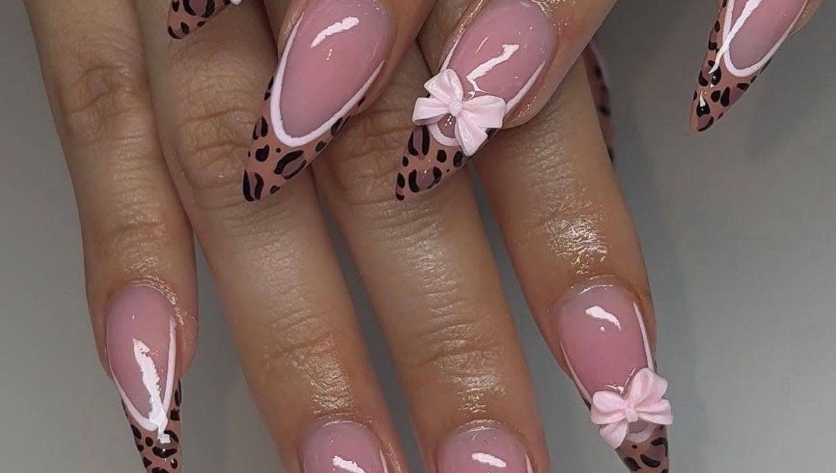 Leopard print nail design with bows at MakeupbyLGA, Portmore, St. Catherine Parish, JM.