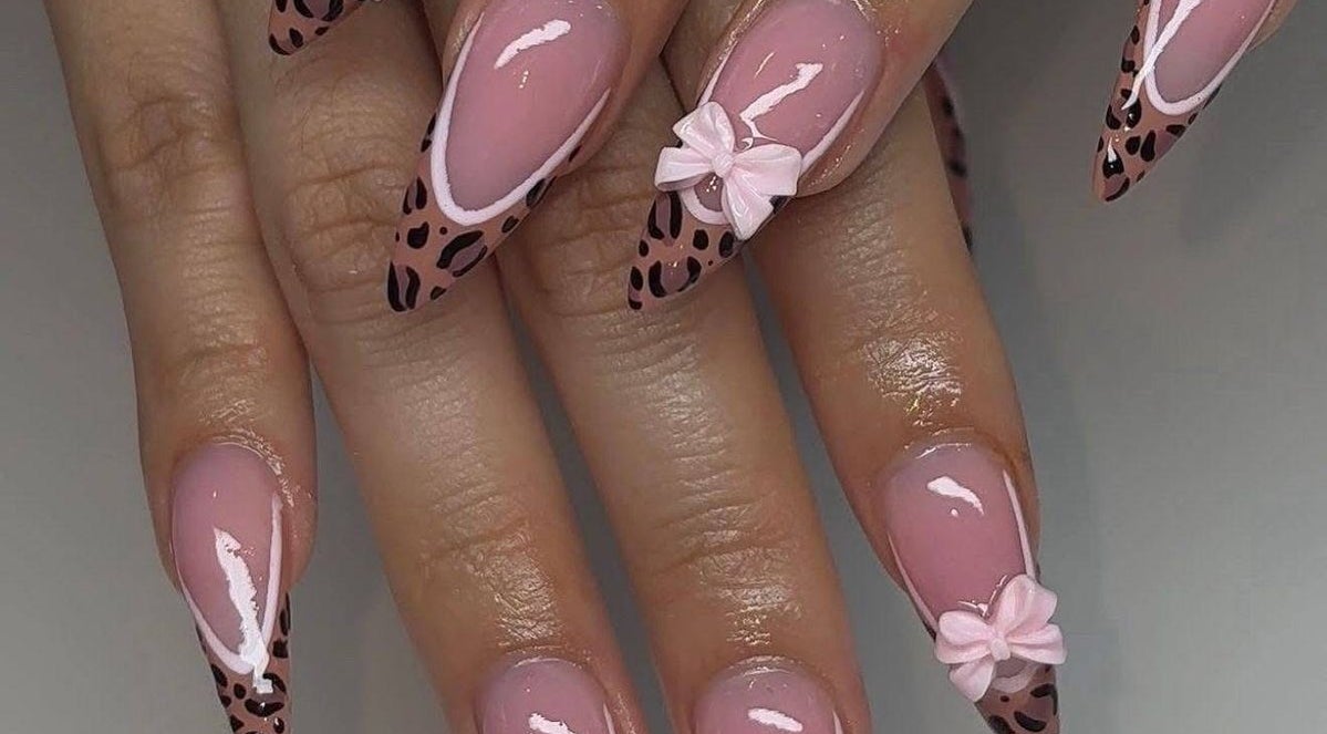 Leopard print nail design with bows at MakeupbyLGA, Portmore, St. Catherine Parish, JM.