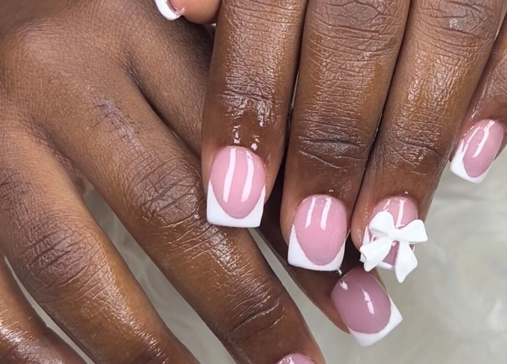 Elegant French manicure with bow art at MakeupbyLGA, Portmore, St. Catherine Parish, JM.