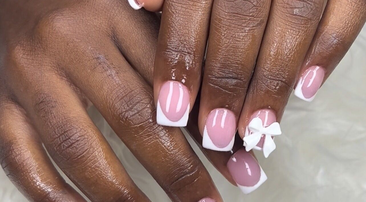 Elegant French manicure with bow art at MakeupbyLGA, Portmore, St. Catherine Parish, JM.