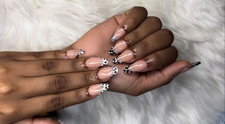 Stylish nail art with black and white dots at MakeupbyLGA in Portmore, St. Catherine Parish, JM.