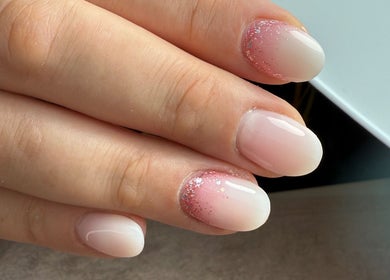Elegant pink and glitter gradient manicure at Clouds Beauty Studio, London, England, GB.