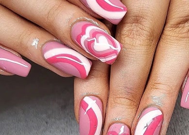 Stylish pink nail art at Clouds Beauty Studio, London, England, GB. Perfect for a chic look.