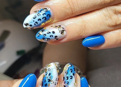Leopard print and blue nail art at Clouds Beauty Studio in London, England, GB.