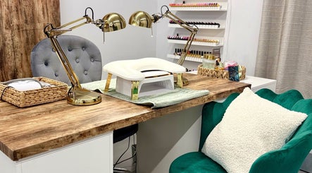 Modern nail station at Clouds Beauty Studio, London, England, GB, featuring plush seating and stylish decor.