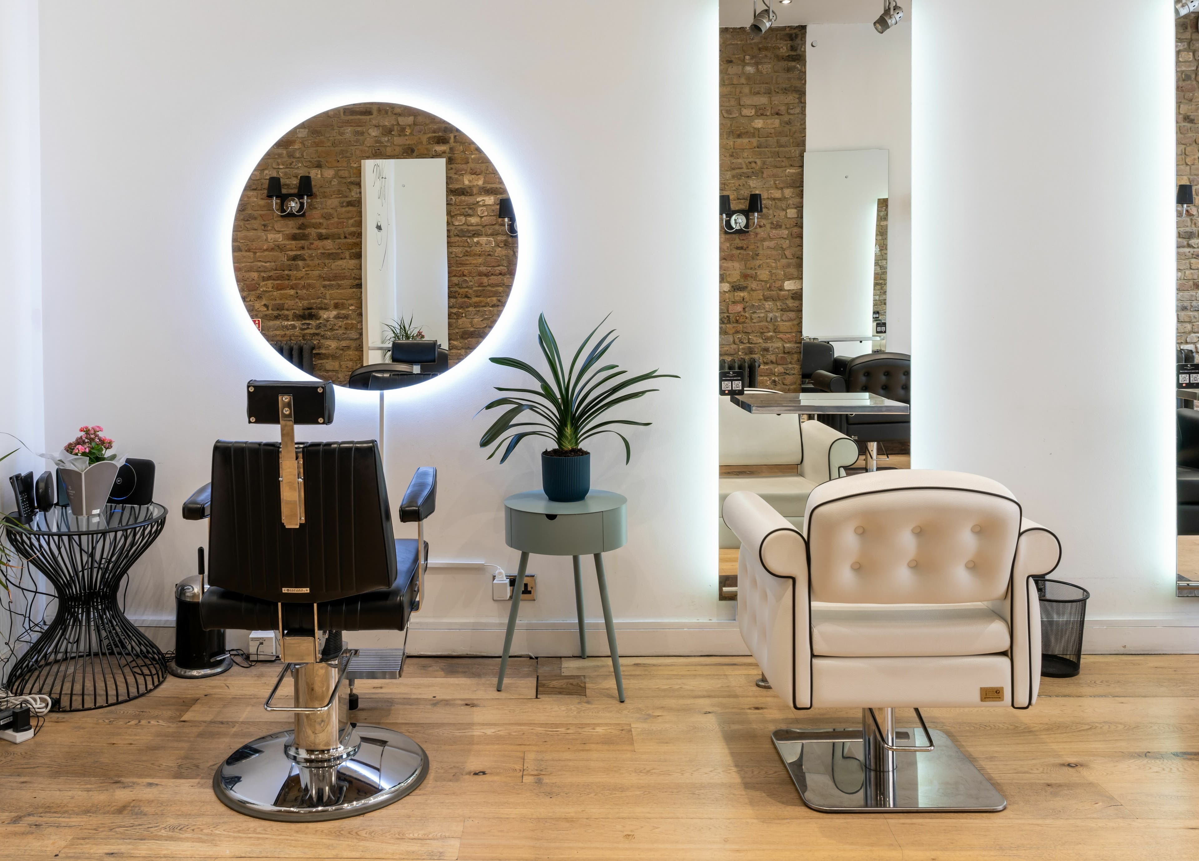 Stylish interior of Chelsea Chair salon in London, England, GB with modern decor and comfortable seating.