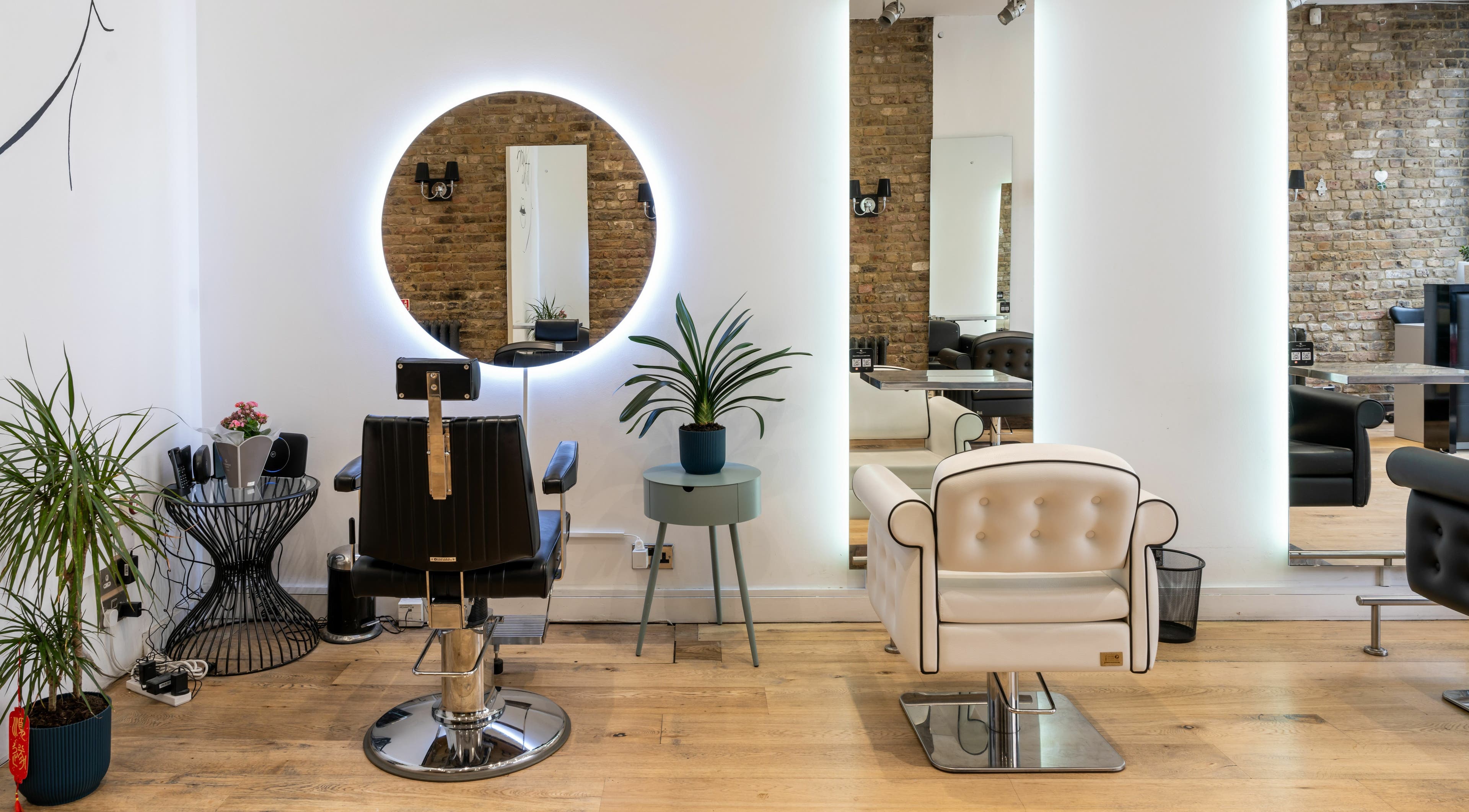 Stylish interior of Chelsea Chair salon in London, England, GB with modern decor and comfortable seating.