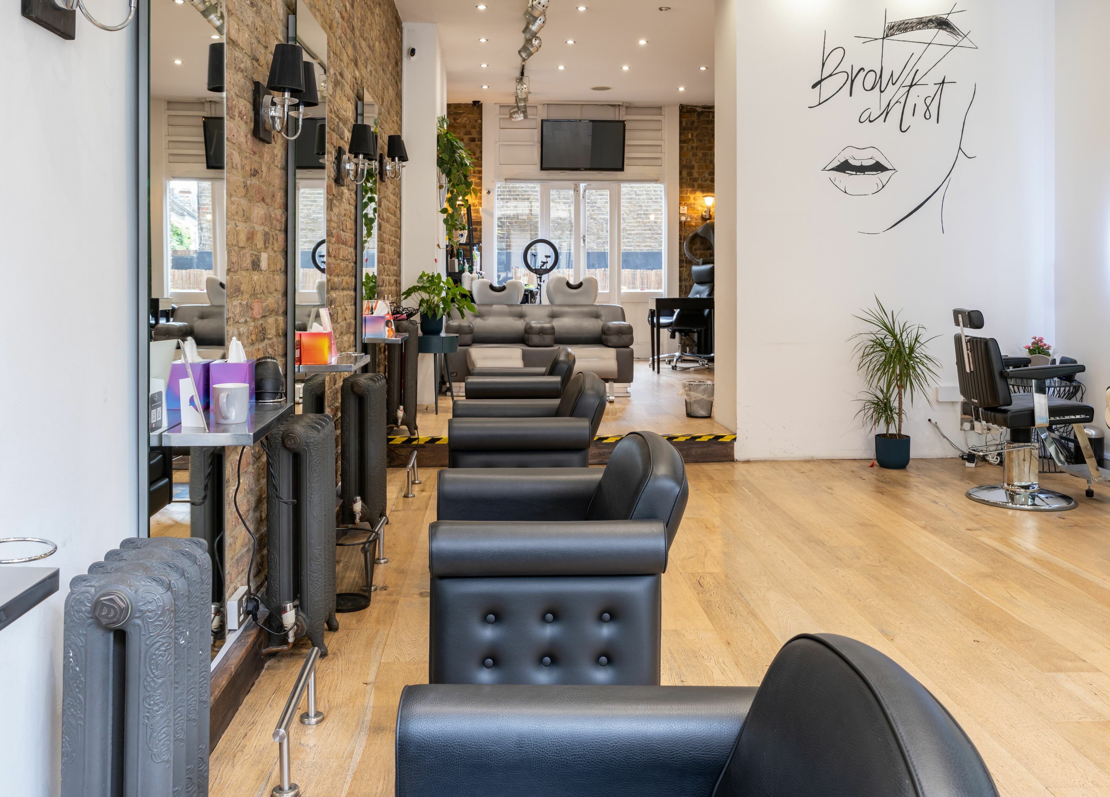 Interior of Chelsea Chair salon, showcasing sleek chairs and stylish decor in London, England, GB.