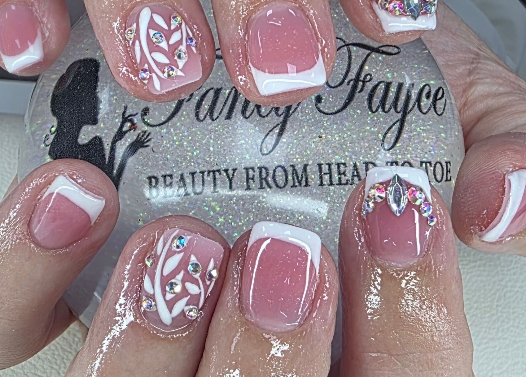 Elegant nail art with rhinestones at Fancy Fayce, Huddersfield, England, GB.