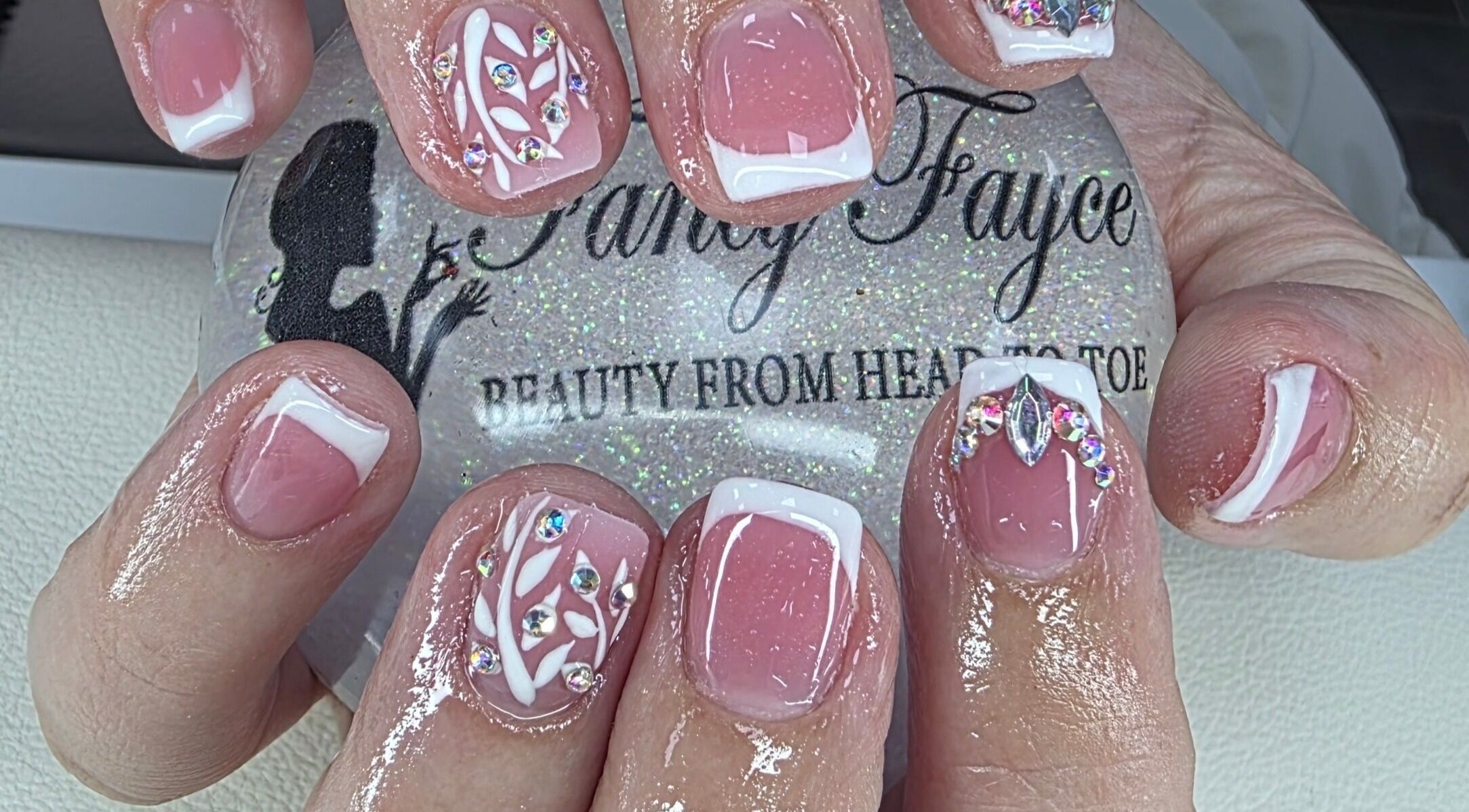 Elegant nail art with rhinestones at Fancy Fayce, Huddersfield, England, GB.