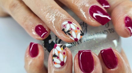 Beautiful floral and burgundy nail art at Fancy Fayce, Huddersfield, England, GB.